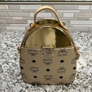 Limited edition MCM mini Stark perfume bag in Berlin gold color